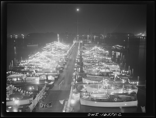 Untitled photo, possibly related to: Detroit, Michigan. A Venetian night party at the Detroit yacht club, whose members represent the wealthier class of manufacturers and their friends. Cabin cruisers and sailboats decorated with lights