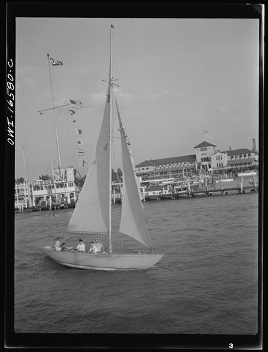 Untitled photo, possibly related to: Detroit, Michigan. A Venetian night party at the Detroit yacht club, whose members represent the wealthier class of manufacturers and their friends. Sailing boat