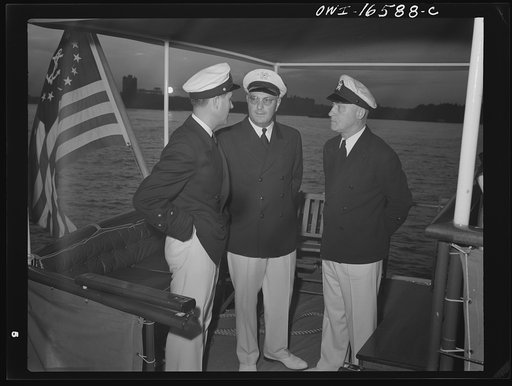 Untitled photo, possibly related to: Detroit, Michigan. A Venetian night party at the Detroit yacht club, whose members represent the wealthier class of manufacturers and their friends. Reviewing the fleet