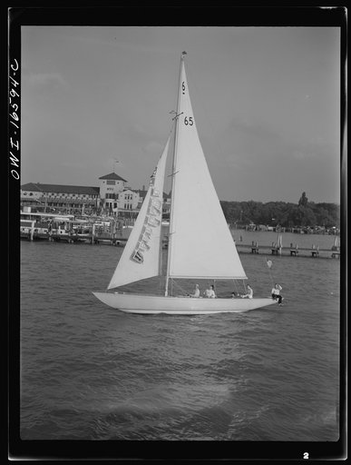 Untitled photo, possibly related to: Detroit, Michigan. A Venetian night party at the Detroit yacht club, whose members represent the wealthier class of manufacturers and their friends. Sailing boat