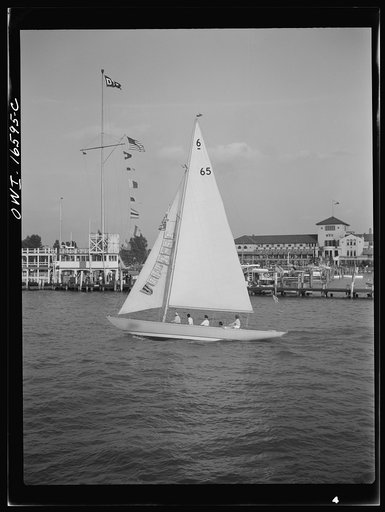 Untitled photo, possibly related to: Detroit, Michigan. A Venetian night party at the Detroit yacht club, whose members represent the wealthier class of manufacturers and their friends. Sailing boat