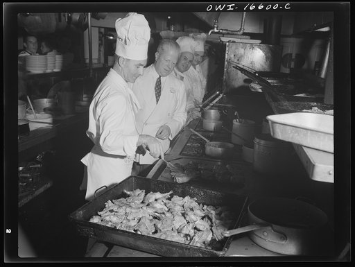 Detroit, Michigan. A Venetian night party at the Detroit yacht club, whose members represent the wealthier class of manufacturers and their friends. Frying chicken
