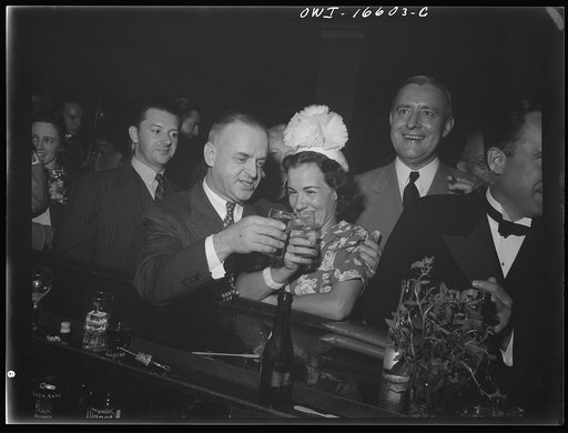 Detroit, Michigan. A Venetian night party at the Detroit yacht club, whose members represent the wealthier class of manufacturers and their friends. Couple drinking at the bar