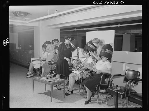 Detroit, Michigan. Women drying their hair in the beauty shop at the Crowley-Milner department store