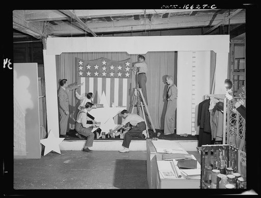 Detroit, Michigan. Installing a window display at the Crowley-Milner department store