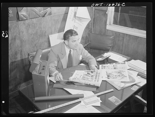 Untitled photo, possibly related to: Detroit, Michigan. Head of the art department with new model at the Crowley-Milner department store.