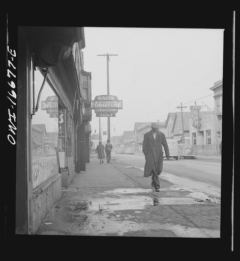 Untitled photo, possibly related to: Detroit, Michigan. Back view of a Negro dressed in a zoot suit, walking in the business district