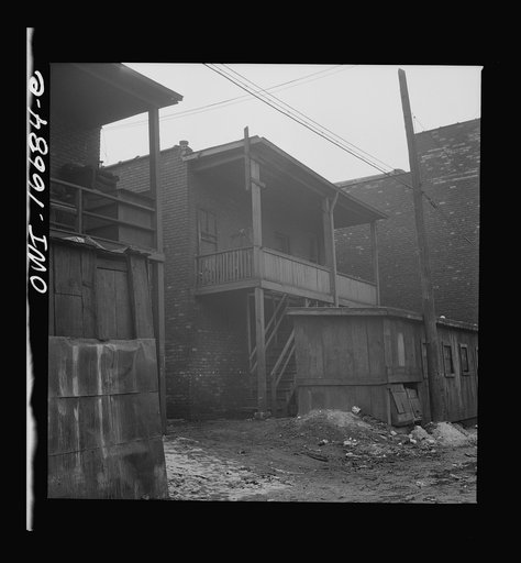 Untitled photo, possibly related to: Detroit, Michigan. Alley in a Negro neighborhood. These are conditions under which families originally lived before moving to the Sojourner Truth housing project