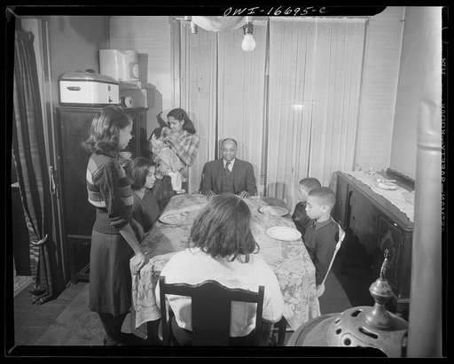 Detroit, Michigan. Negro family at dinner. These are conditions under which families originally lived before moving to the Sojourner Truth housing project