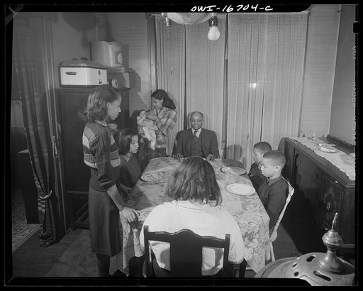 Untitled photo, possibly related to: Detroit, Michigan. Negro family at dinner. These are conditions under which families originally lived before moving to the Sojourner Truth housing project
