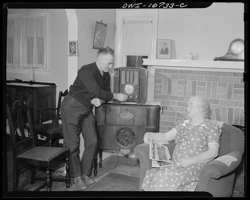 Royal Oak, Michigan. A family listening to the radio and reading Father Coughlin's newspaper "Social justice"