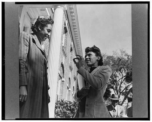 Daytona Beach, Florida. Bethune-Cookman College. Two teachers having a conversation on the steps of the administration