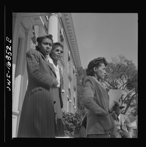 Untitled photo, possibly related to: Daytona Beach, Florida. Bethune-Cookman College. Two teachers having a conversation on the steps of the administration