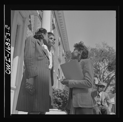 Untitled photo, possibly related to: Daytona Beach, Florida. Bethune-Cookman College. Two teachers having a conversation on the steps of the administration