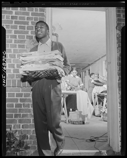 Daytona Beach, Florida. Bethune-Cookman College. Students leaving the school laundry with clean shirts and linen
