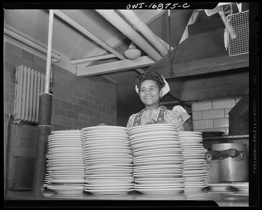 Daytona Beach, Florida. Bethune-Cookman College. Student preparing plate luncheons at lunch time. This work enables her to help with her tuition fees