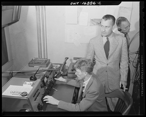 Orlando, Florida. Wings over Jordan, a popular Sunday morning radio program broadcast by Columbia Broadcasting System from station WDBO. Control room checking with master station in New York to see if program is coming through clearly