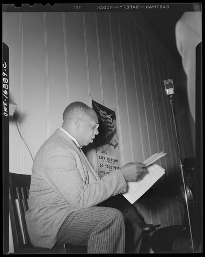 Orlando, Florida. Wings over Jordan, a popular Sunday morning radio program broadcast by Columbia Broadcasting System from station WDBO. Rev. Glenn T. Settles, founder and narrator of the program, going over his script