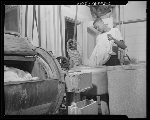 Daytona Beach, Florida. Bethune-Cookman College. A student who works in the school laundry to help pay his tuition