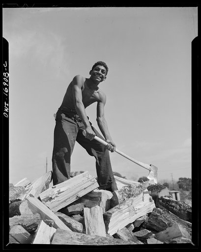 Daytona Beach, Florida. Bethune-Cookman College. This boy, who is a NYA (National Youth Administration) student, receives thirty-five cents an hour for chopping wood. By doing this he is able to pay his tuition fees