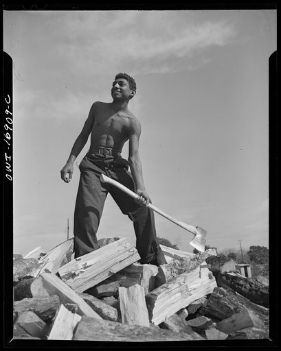 Daytona Beach, Florida. This boy, who is a NYA (National Youth Administration) student, receives thirty-five cents an hour for chopping wood. By doing this he is able to pay his tuition fees