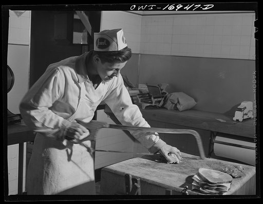 Untitled photo, possibly related to: Blue Island, Illinois. Jerry Senise spends two hours every afternoon working at a butcher store to help out the family and earn his spending money