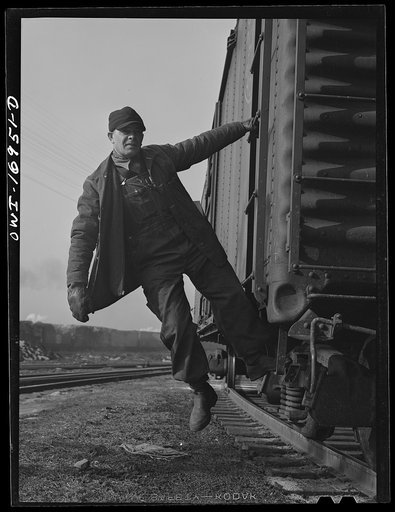 Daniel Senise riding a car at work in an Indiana Harbor Belt Line railroad yard