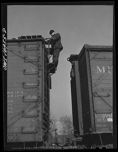 Daniel Senise releasing hand brakes on a car while at work in an Indiana Harbor Belt Line railroad yard