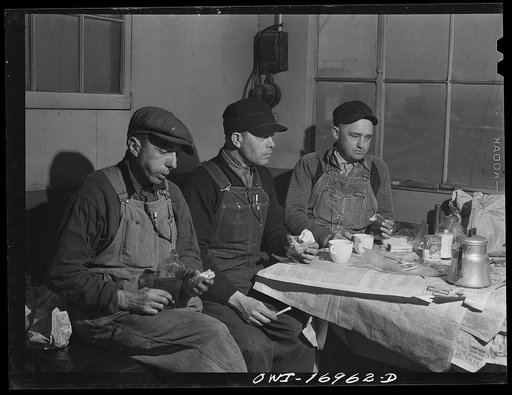 Untitled photo, possibly related to: Daniel Senise at lunch in the work shanty at an Indiana Harbor Belt Line railroad yard. With him are (left) switchman John McCarthy and (right) switchman E.H. Alrecht