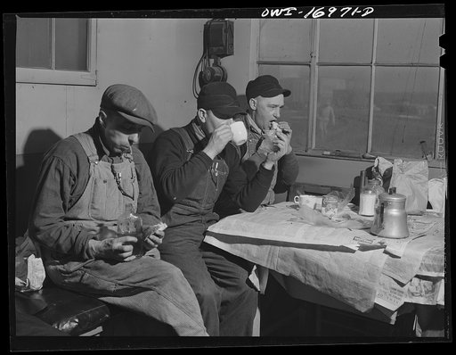 Untitled photo, possibly related to: Daniel Senise at lunch in the work shanty at an Indiana Harbor Belt Line railroad yard. With him are (left) switchman John McCarthy and (right) switchman E.H. Alrecht