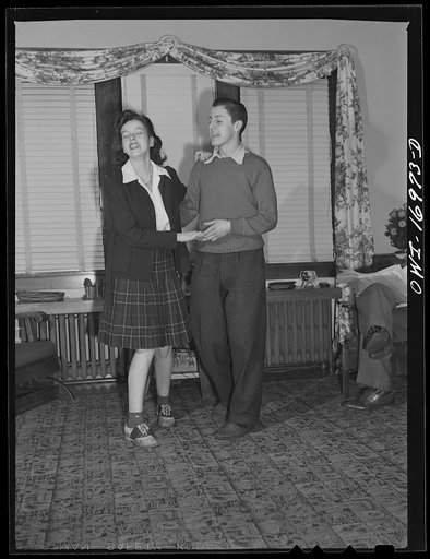 Blue Island, Illinois. Before going out on a date, Jerry Senise and his friend Mary Lou Grubles dance awhile to the music of the radio