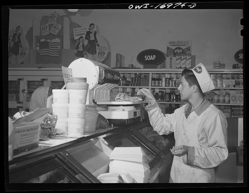 Blue Island, Illinois. Jerry Senise spends two hours every afternoon working at a butcher store to help out the family and earn his spending money