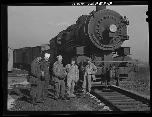 Daniel Senise and his crew with their engine in an Indiana Harbor Belt Line railroad yard. Left to right: Daniel Senise, switchman, conductor and foreman; Edward Kletecka, fireman; F.K. Gwinner, engineer; E.H. Albercht, switchman and John McCarthy, switchman