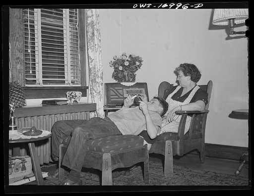 Blue Island, Illinois. Listening to a radio program in the Senise home