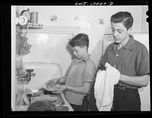 Untitled photo, possibly related to: Blue Island, Illinois. Bobby and Jerry Senise doing the dishes while their mother has gone off to help with the Red Cross canteen