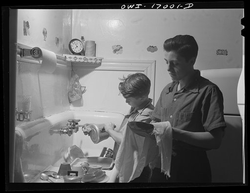 Blue Island, Illinois. Bobby and Jerry Senise doing the dishes while their mother has gone off to help with the Red Cross canteen