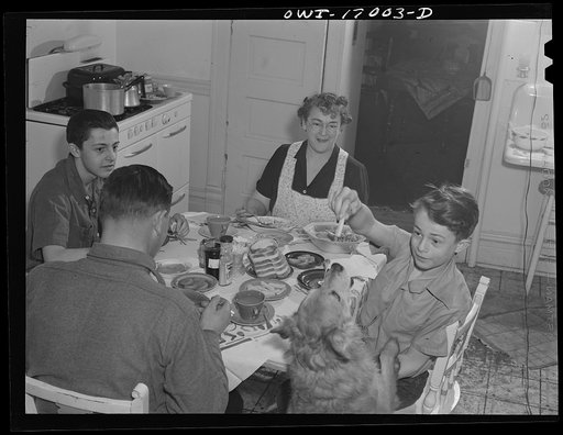 Blue Island, Illinois. "Pooch" getting his dinner from Bobby Senise