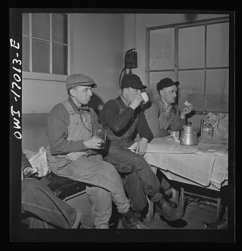 Untitled photo, possibly related to: Daniel Senise at lunch in the work shanty at an Indiana Harbor Belt Line railroad yard. With him are (left) switchman John McCarthy and (right) switchman E.H. Albrecht