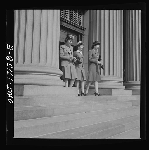 Washington, D.C. Girls employed by the U.S. Office for Emergency Management (OEM) coming out of church