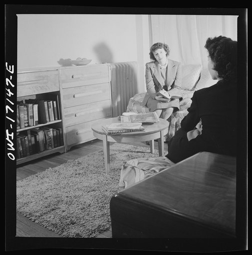 Untitled photo, possibly related to: Washington, D.C. A girl employed by the U.S. government, a new arrival at a boardinghouse, being greeted by her roommates