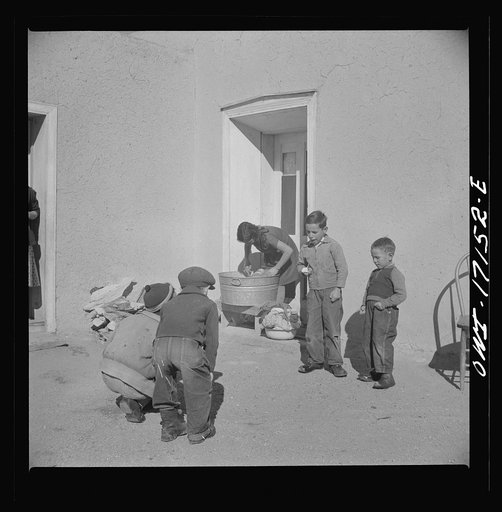 Untitled photo, possibly related to: Trampas, New Mexico. The wife and daughter of Juan Lopez, the majordomo (mayor) [i.e., steward], doing the family washing
