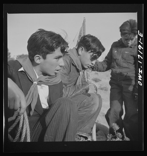 Untitled photo, possibly related to: Taos County, New Mexico. Father Cassidy, the Catholic priest of the parish of Penasco, telling his troop of Boy Scouts about the science of geology