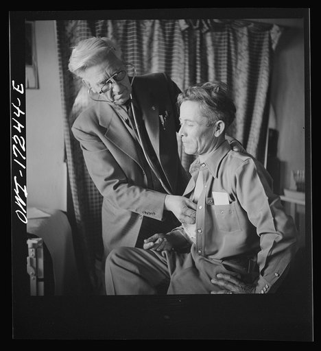 Penasco, New Mexico. Doctor Onstine, medical doctor, making an examination in the clinic operated by the Taos County cooperative health association
