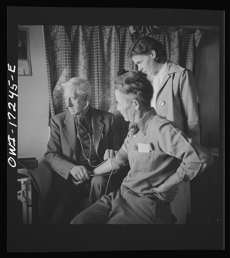 Untitled photo, possibly related to: Penasco, New Mexico. Doctor Onstine, medical doctor, making an examination in the clinic operated by the Taos County cooperative health association