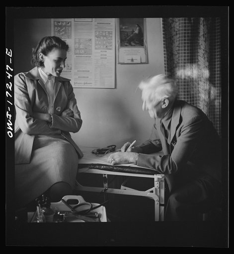 Untitled photo, possibly related to: Penasco, New Mexico. Doctor Onstine, medical doctor, writing a prescription in the clinic operated by the Taos County cooperative health association