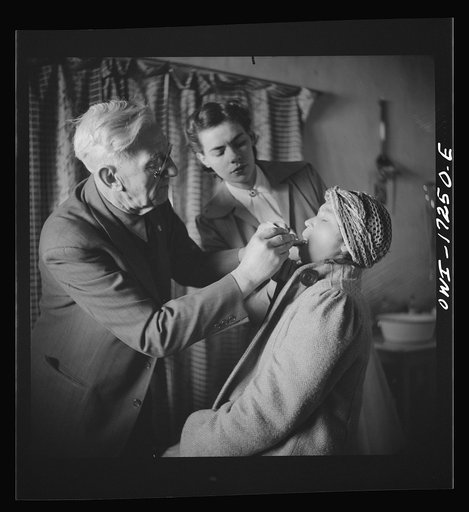 Untitled photo, possibly related to: Penasco, New Mexico. Doctor Onstine, medical doctor, making an examination in the clinic operated by the Taos County cooperative health association