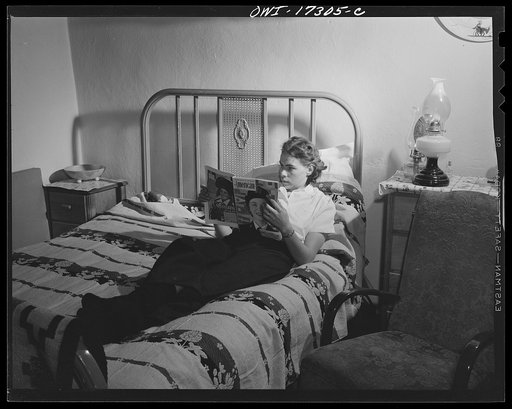 Penasco, New Mexico. Evenings are long for Marjorie Muller, in her lonely post as resident nurse at the clinic operated by the Taos County cooperative health association