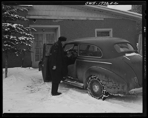 Taos County, New Mexico. Father Cassidy, the Catholic priest of the parish of Penasco, starting on a mission to a remote village in his parish