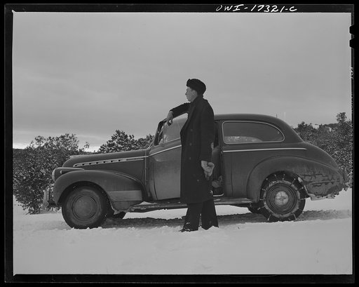 Untitled photo, possibly related to: Taos County, New Mexico. Father Cassidy, the Catholic priest of the parish of Penasco, coming into the village of Chamisal
