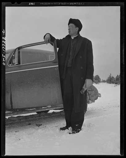 Untitled photo, possibly related to: Taos County, New Mexico. Father Cassidy, the Catholic priest of the parish of Penasco, coming into the village of Chamisal